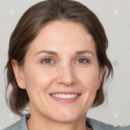 Joyful white adult female with medium  brown hair and grey eyes