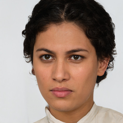 Neutral white young-adult female with short  brown hair and brown eyes