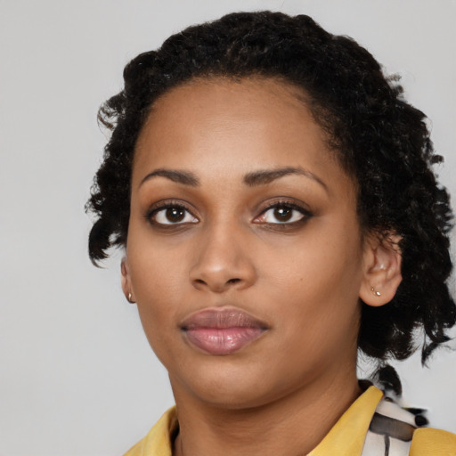 Neutral black young-adult female with medium  black hair and brown eyes