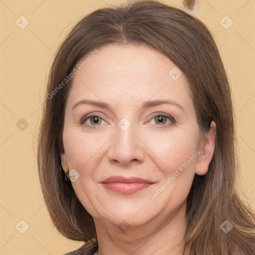 Joyful white adult female with long  brown hair and brown eyes