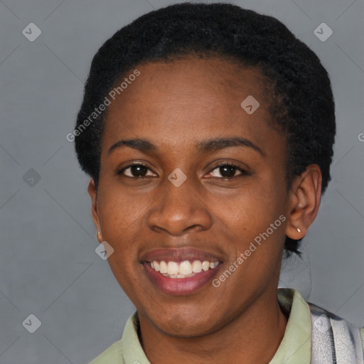 Joyful black young-adult female with short  black hair and brown eyes