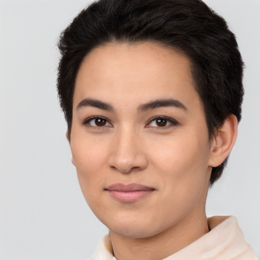 Joyful latino young-adult female with short  black hair and brown eyes
