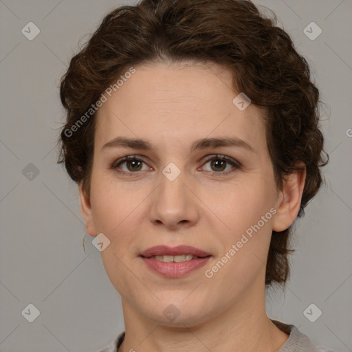 Joyful white young-adult female with medium  brown hair and green eyes