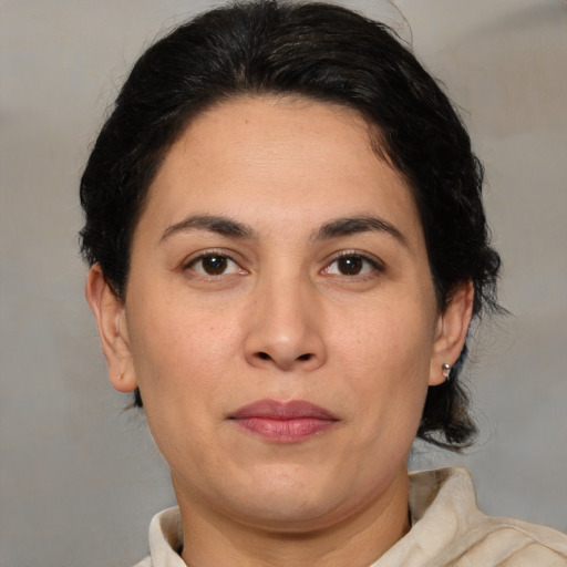 Joyful white adult female with medium  brown hair and brown eyes