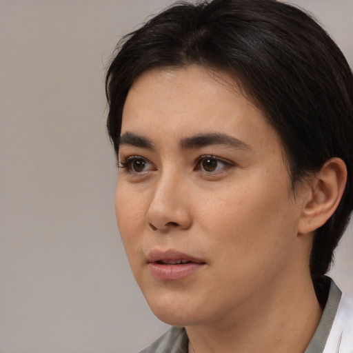 Neutral white young-adult female with medium  black hair and brown eyes