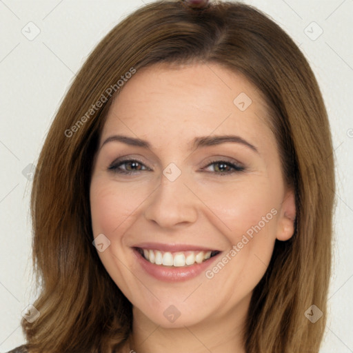 Joyful white young-adult female with long  brown hair and brown eyes