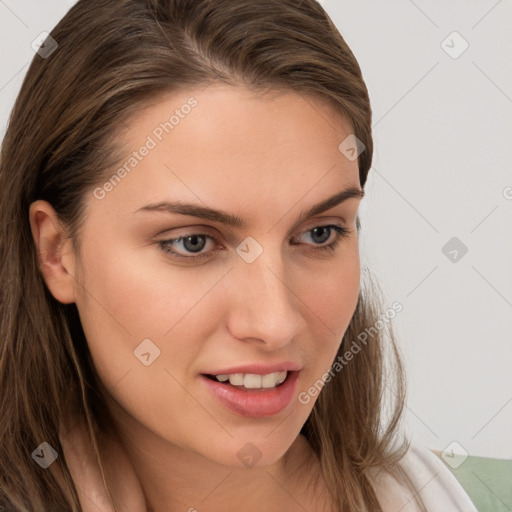 Joyful white young-adult female with long  brown hair and blue eyes