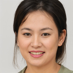 Joyful white young-adult female with medium  brown hair and brown eyes