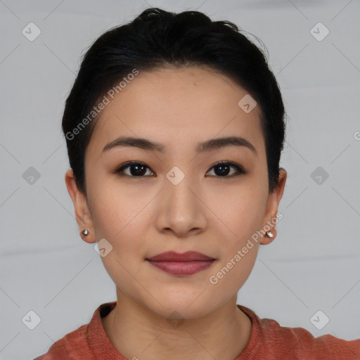 Joyful asian young-adult female with short  black hair and brown eyes