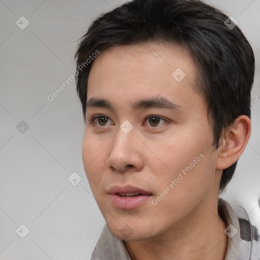 Neutral white young-adult male with short  black hair and brown eyes