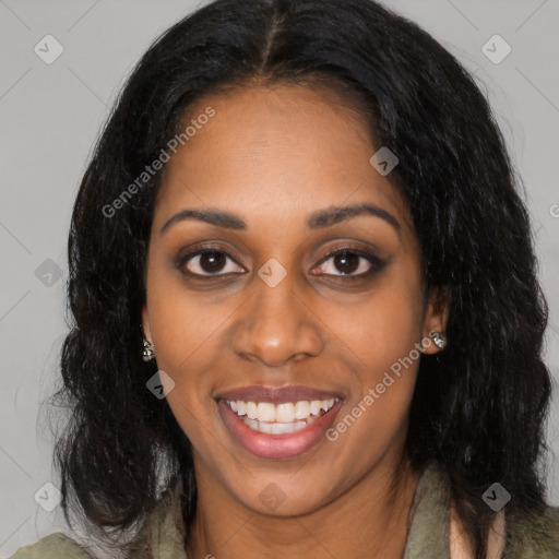 Joyful black young-adult female with long  black hair and brown eyes