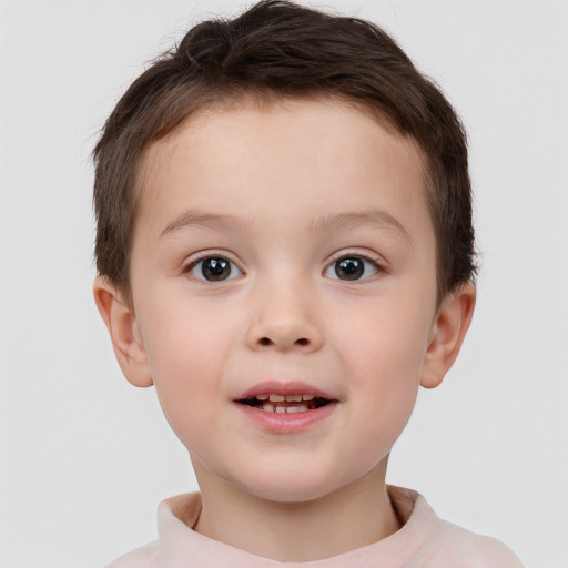 Joyful white child male with short  brown hair and brown eyes