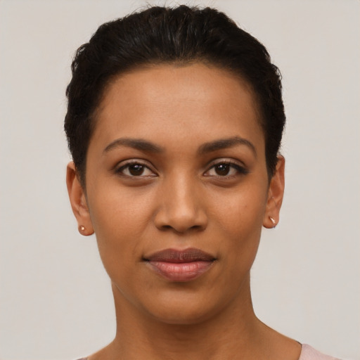 Joyful latino young-adult female with short  black hair and brown eyes
