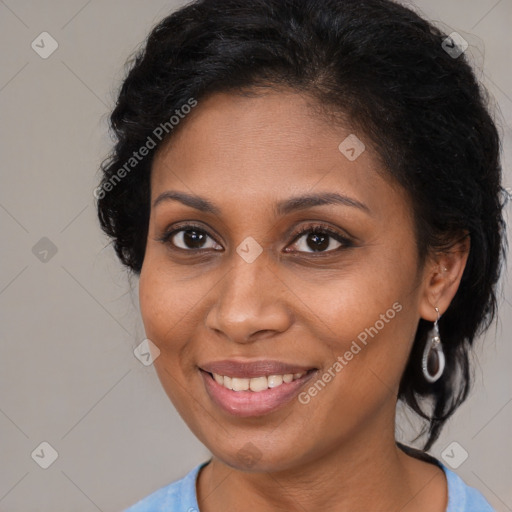 Joyful black young-adult female with medium  brown hair and brown eyes