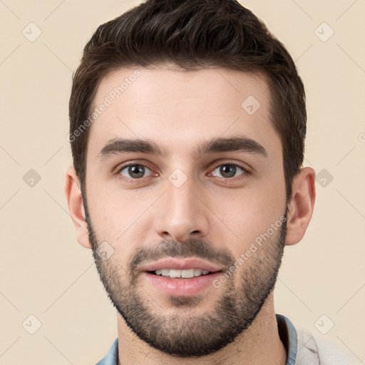 Joyful white young-adult male with short  brown hair and brown eyes