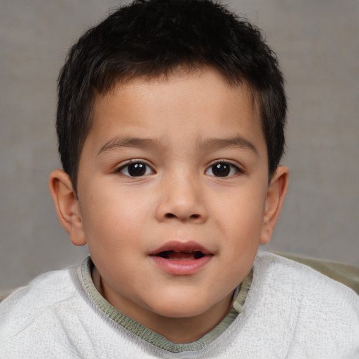 Joyful white child male with short  brown hair and brown eyes