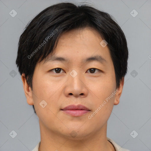 Neutral asian adult male with short  brown hair and brown eyes