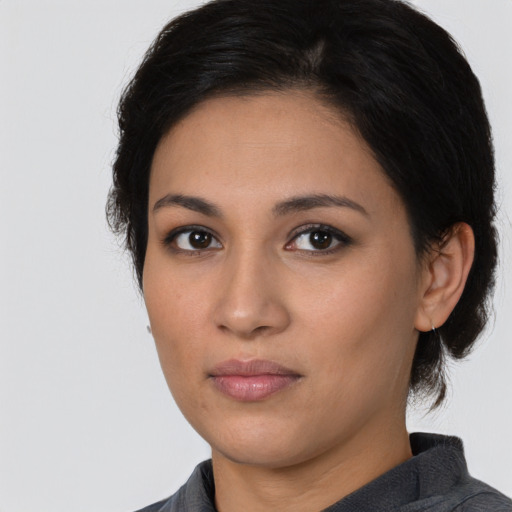 Neutral latino young-adult female with medium  black hair and brown eyes
