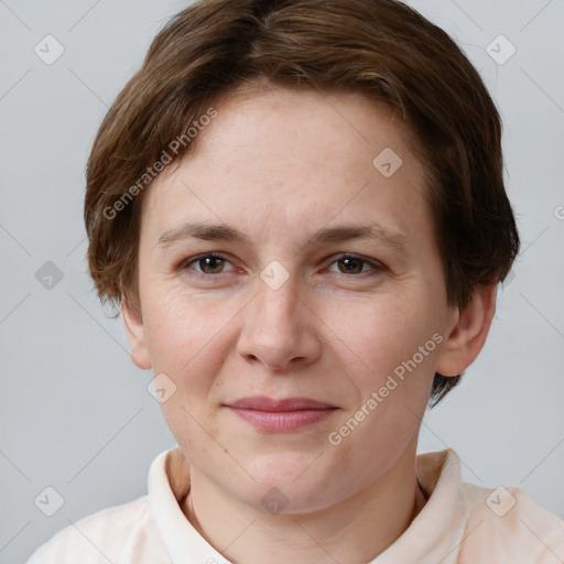 Joyful white young-adult female with short  brown hair and grey eyes