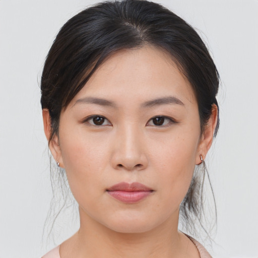 Neutral asian young-adult female with medium  brown hair and brown eyes