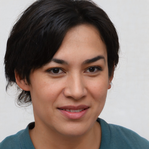 Joyful asian young-adult female with medium  brown hair and brown eyes