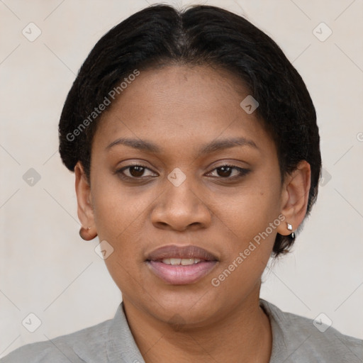 Joyful black young-adult female with short  brown hair and brown eyes