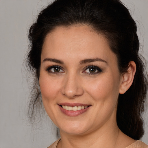 Joyful white young-adult female with medium  brown hair and brown eyes