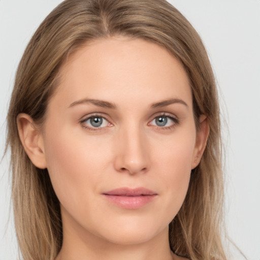 Joyful white young-adult female with long  brown hair and grey eyes