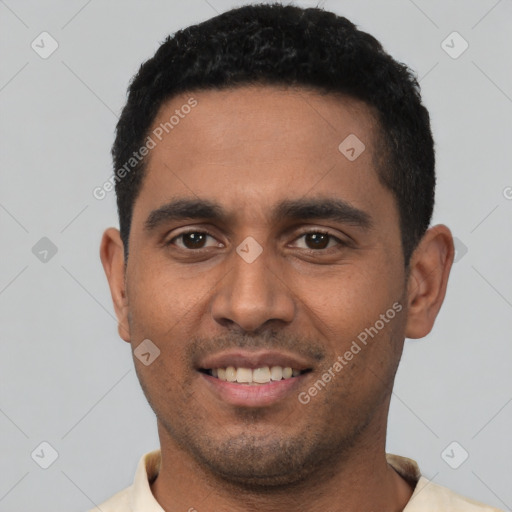 Joyful latino young-adult male with short  black hair and brown eyes