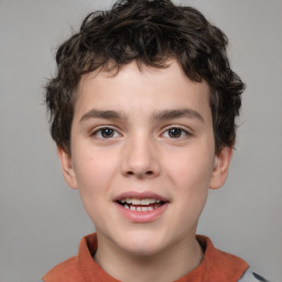 Joyful white child male with short  brown hair and brown eyes