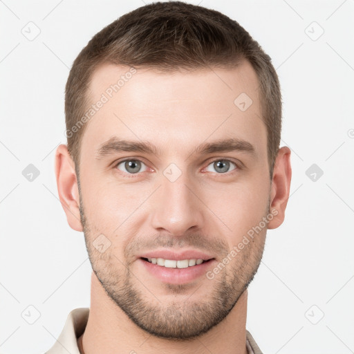 Joyful white young-adult male with short  brown hair and grey eyes