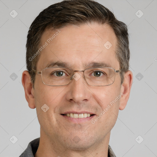 Joyful white adult male with short  brown hair and grey eyes