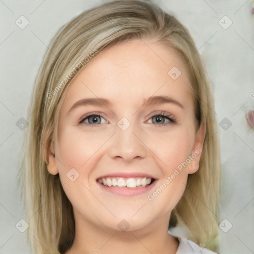 Joyful white young-adult female with medium  brown hair and blue eyes