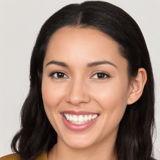 Joyful white young-adult female with long  black hair and brown eyes