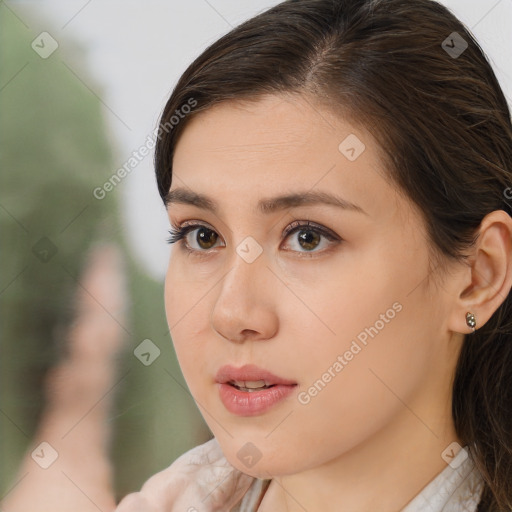 Neutral white young-adult female with long  brown hair and brown eyes