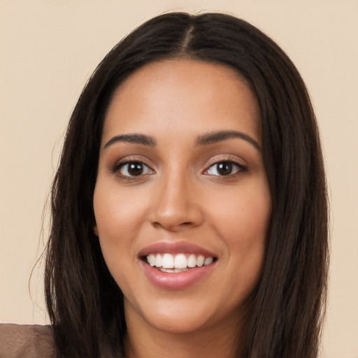 Joyful white young-adult female with long  black hair and brown eyes