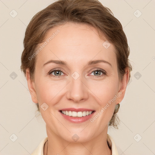 Joyful white adult female with medium  brown hair and grey eyes