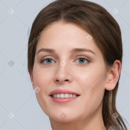 Joyful white young-adult female with long  brown hair and grey eyes