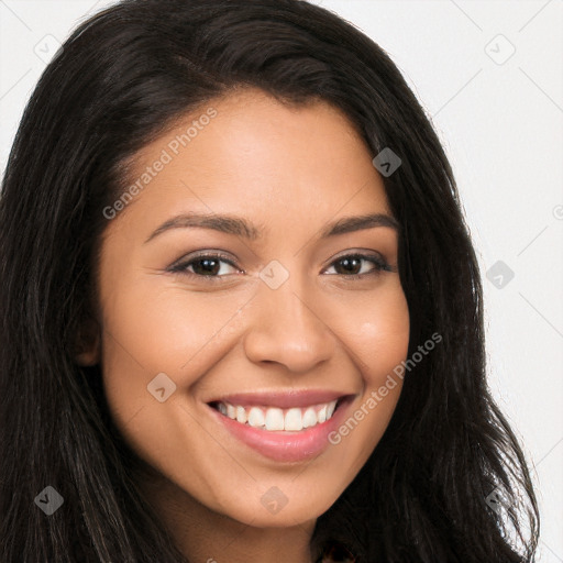 Joyful latino young-adult female with long  brown hair and brown eyes