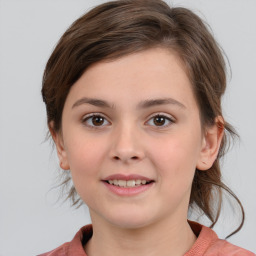 Joyful white child female with medium  brown hair and brown eyes