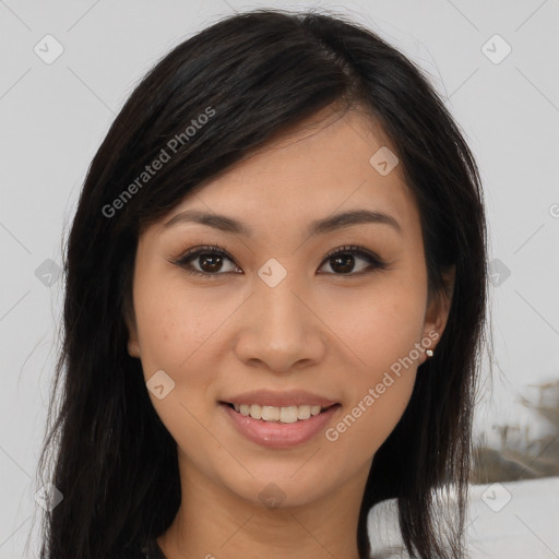 Joyful latino young-adult female with long  brown hair and brown eyes