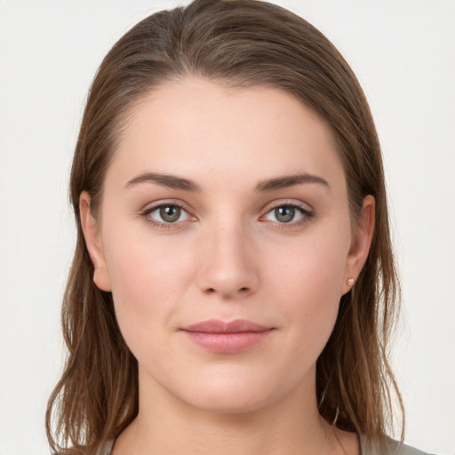 Joyful white young-adult female with long  brown hair and grey eyes