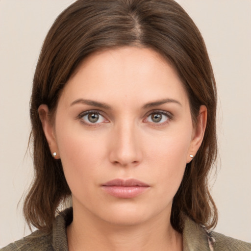 Neutral white young-adult female with medium  brown hair and brown eyes