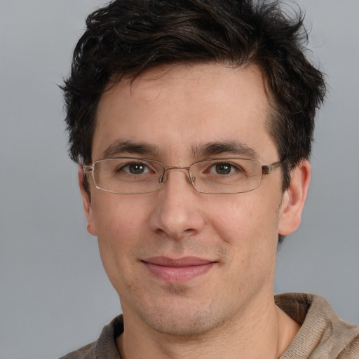 Joyful white adult male with short  brown hair and brown eyes