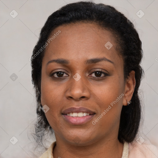 Joyful black adult female with medium  brown hair and brown eyes