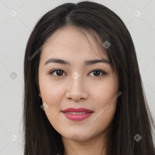 Joyful asian young-adult female with long  brown hair and brown eyes