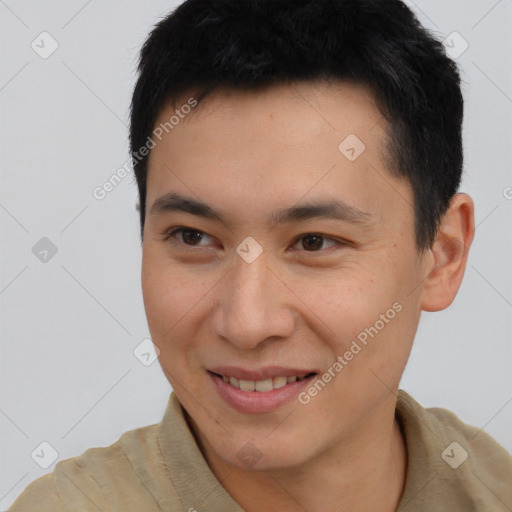 Joyful asian young-adult male with short  brown hair and brown eyes