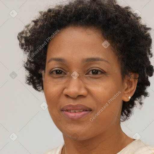 Joyful black adult female with short  brown hair and brown eyes