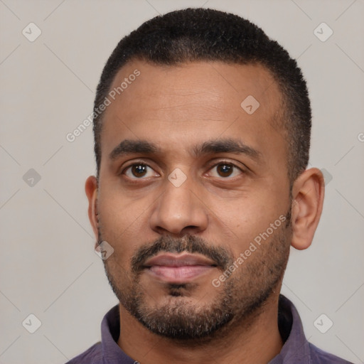 Neutral latino young-adult male with short  black hair and brown eyes