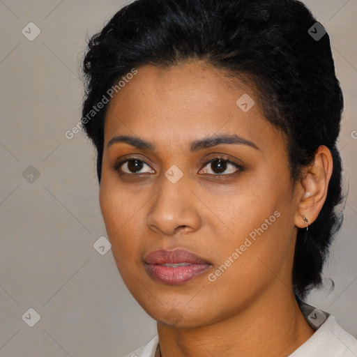 Joyful black young-adult female with medium  black hair and brown eyes